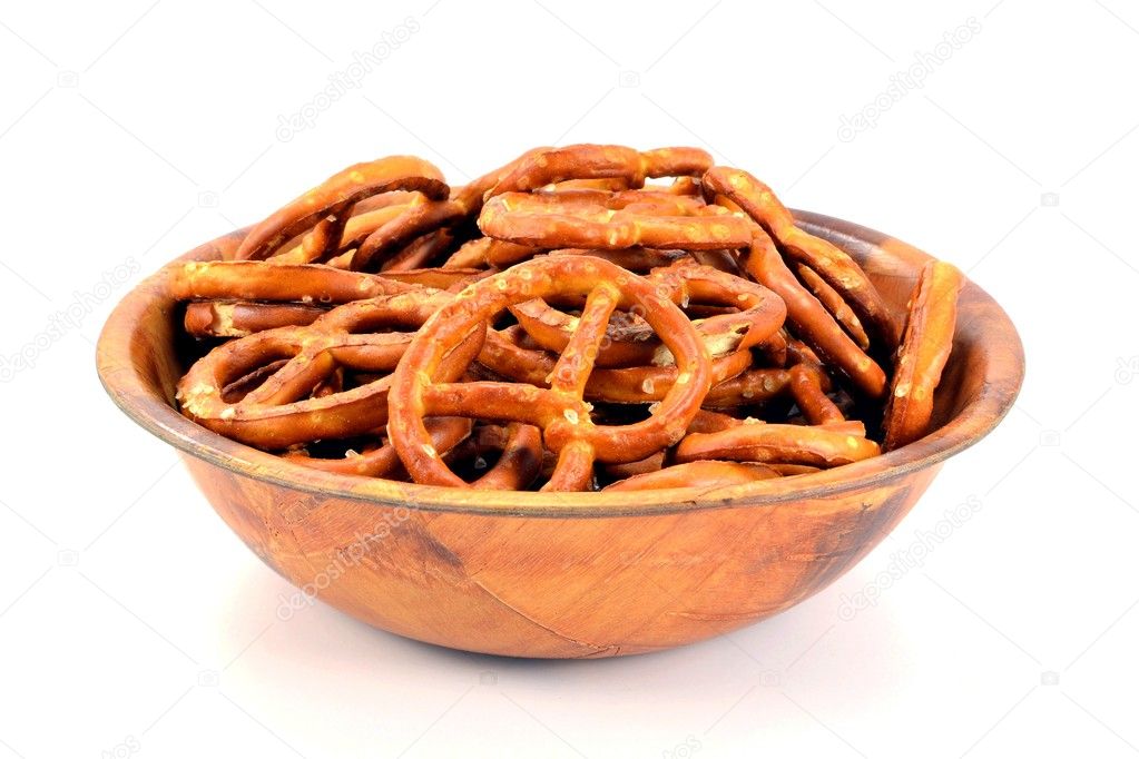 A wooden bowl of salted pretzels