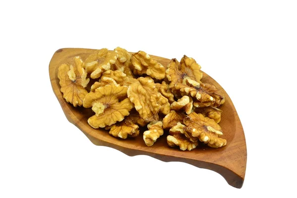 Walnuts on a wooden leaf plate — Stock Photo, Image
