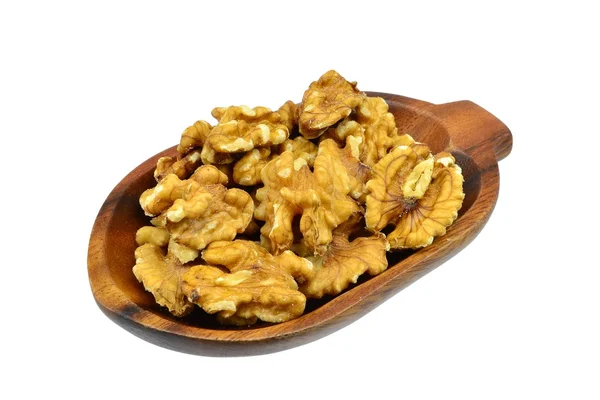 Walnuts on an oval wooden plate — Stock Photo, Image