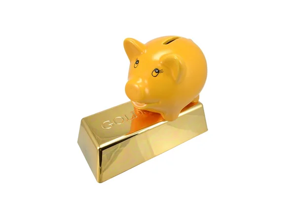 Piggy bank on a gold bar — Stock Photo, Image
