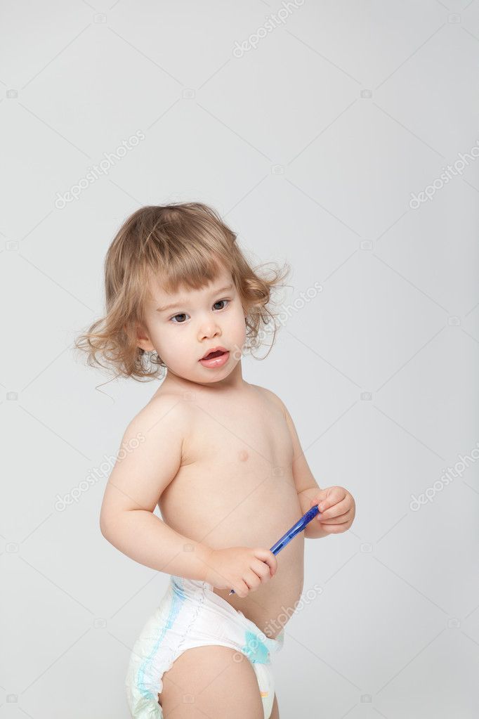 Cute baby in diapers with pen — Stock Photo © shotsstudio #5803388