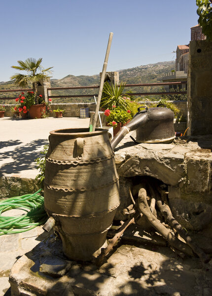 Primitive copper alambic still and clay jar