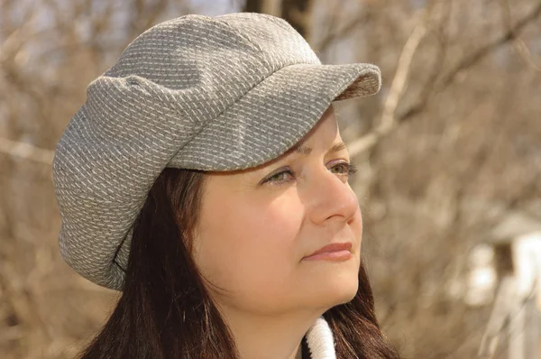 Young woman profile with a cap — Stock Photo, Image