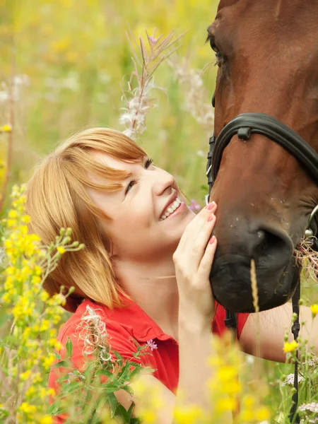 Portrait of young smiling girl with horse closeup — Stok fotoğraf