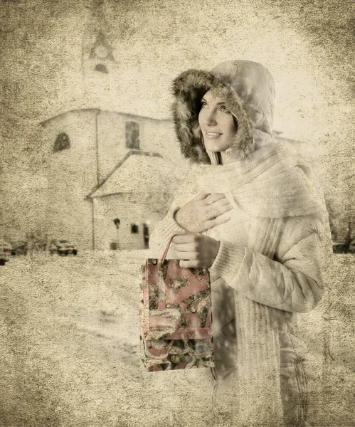 Девушка и рождественская сумка — стоковое фото