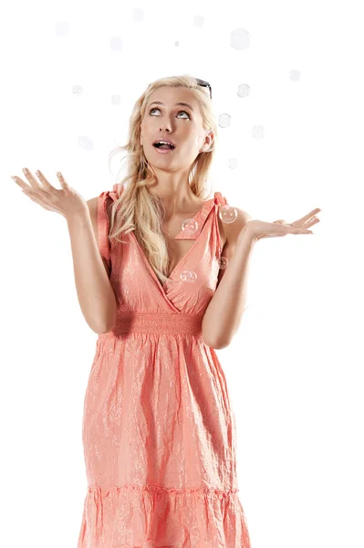 Blond beautiful girl standing against white background looking t — Stock Photo, Image