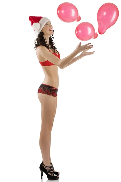 Sexy Weihnachtsmann spielt mit Luftballon — Stockfoto