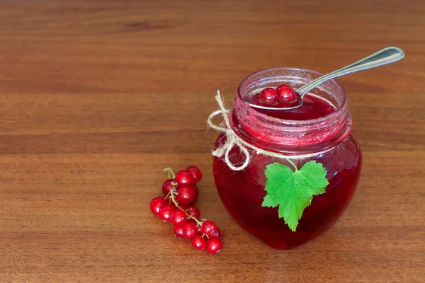 Glass pot of currant jam — Stock Photo, Image