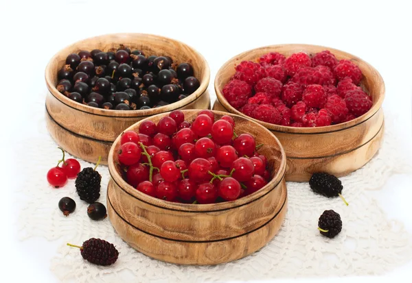 Fresh berries in wooden bowls — Stock Photo, Image