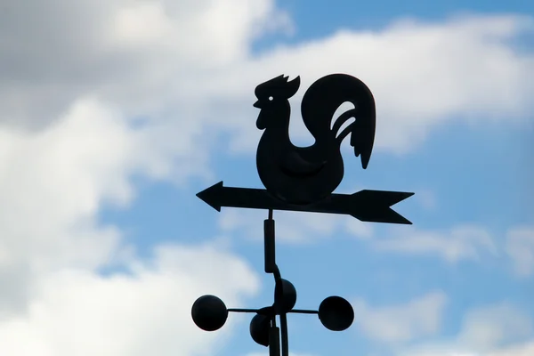 stock image Weather vane on a backgrounds a cloudy sky