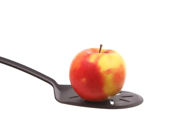Apple on a spoon — Stock Photo, Image