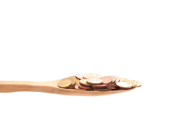 Dinheiro em uma colher de madeira isolada em um fundo branco — Fotografia de Stock