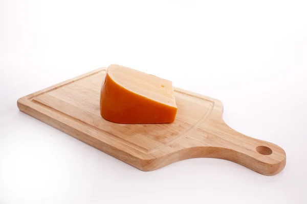 stock image Cheese on a cutting board