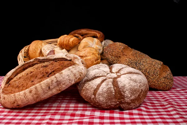 Bread against black — Stock Photo, Image