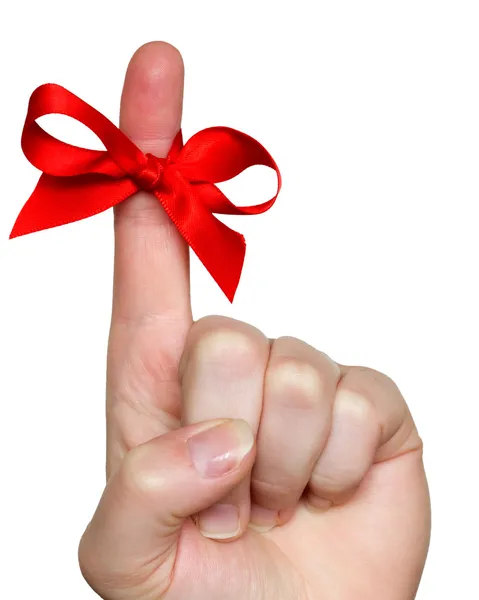 Red bow on finger — Stock Photo, Image