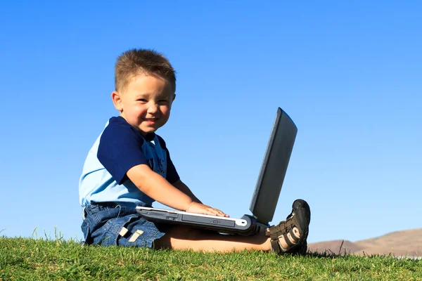 Boy with laptop Royalty Free Stock Photos