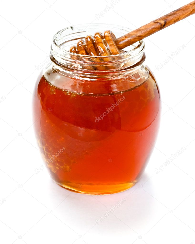 Honey with dipper and jar