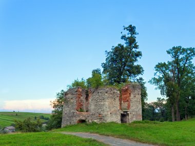 Summer evening Svirzh Castle dilapidated tower view (Ukraine). clipart