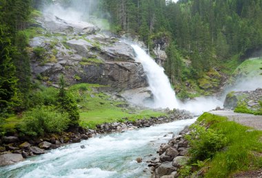 Alps waterfall summer view clipart