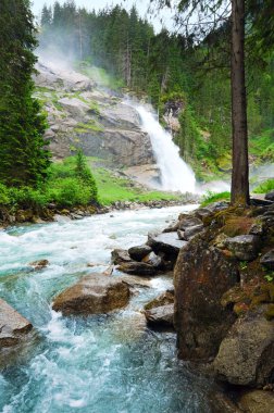 Alps waterfall summer view clipart