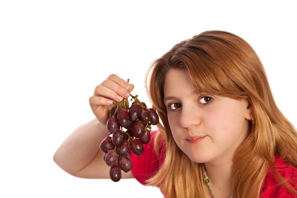 Teenager showing fresh grapes — Stock Photo, Image