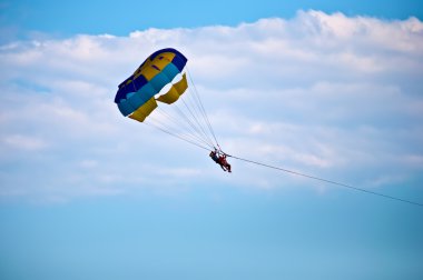 Parasailing in summer . clipart