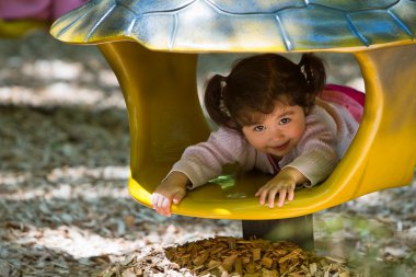 Toddler playing in playground toy clipart