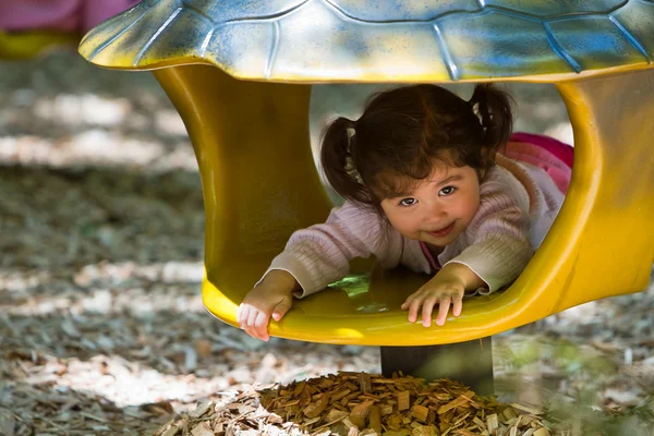 Toddler playing in playground toy — Stock Photo, Image