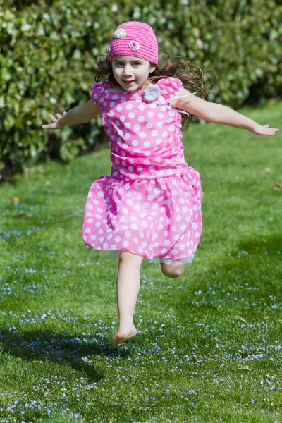 Young girl running and flying — Stock Photo, Image
