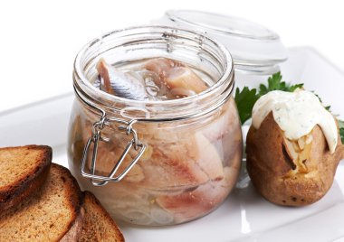 Herring salt fillet in the glass jar clipart