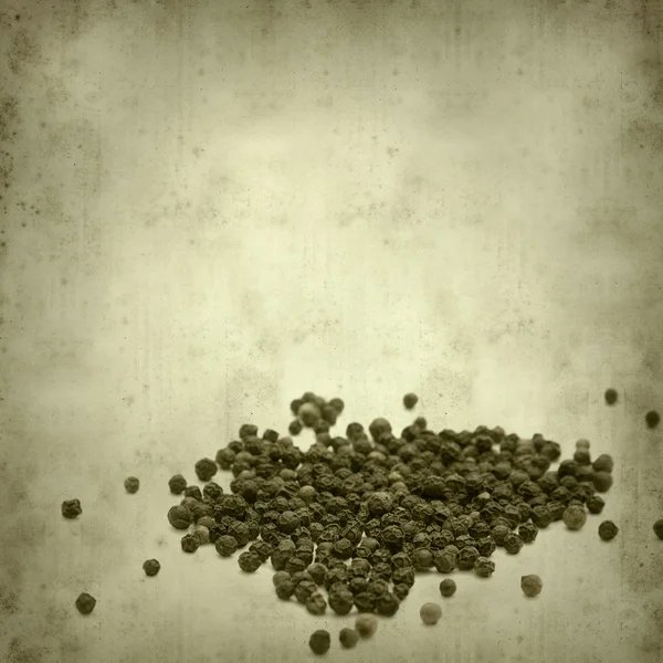 ブラック胡椒と古い用紙の背景のテクスチャ — ストック写真