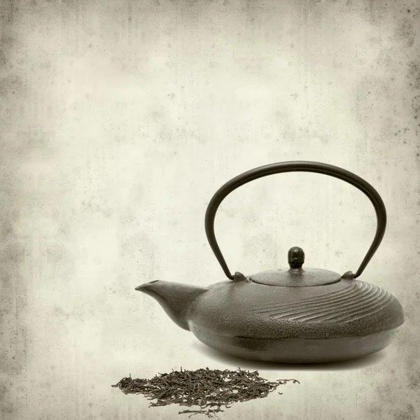 Textured old paper background with japanese cast iron teapot and — Stock Photo, Image