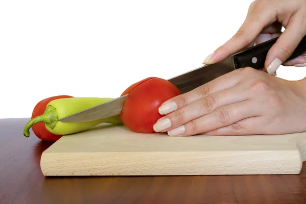 stock image Female hands cutting vegetables isolated