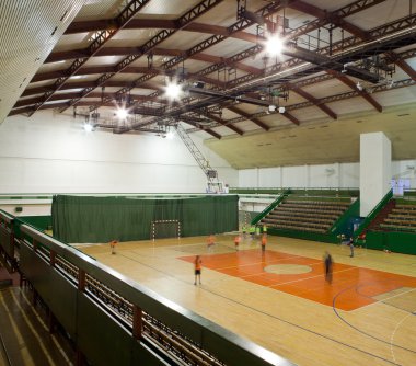 Interior of a modern multifunctional gymnasium with young