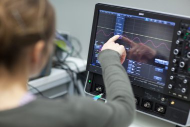 Female scientist doing research in a quantum optics lab (color t clipart