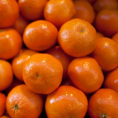 Mandarins on display in the farmers market clipart