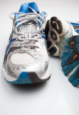 Pair of running shoes on a white background (shallow DOF; color clipart