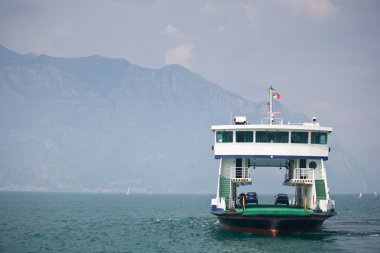 Ferry transporting cars on a lake clipart