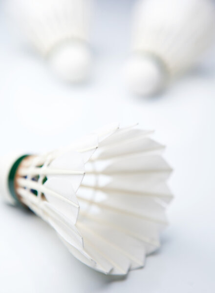 Badminton shuttlecocks on white (color toned image)