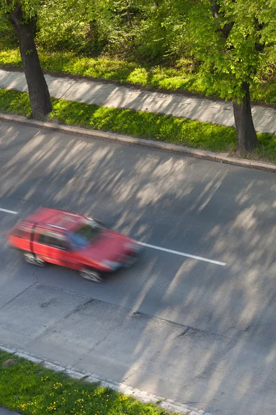 Speeding concept - Cars moving fast on a road on a lovely sunny — Stock Photo, Image