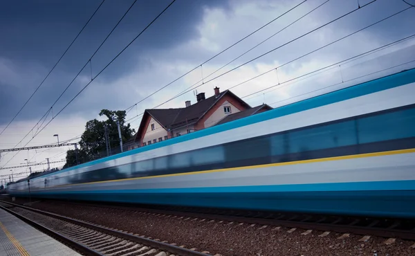 Fast train passing by (motion blur is used to convey movement; c — Stock Photo, Image