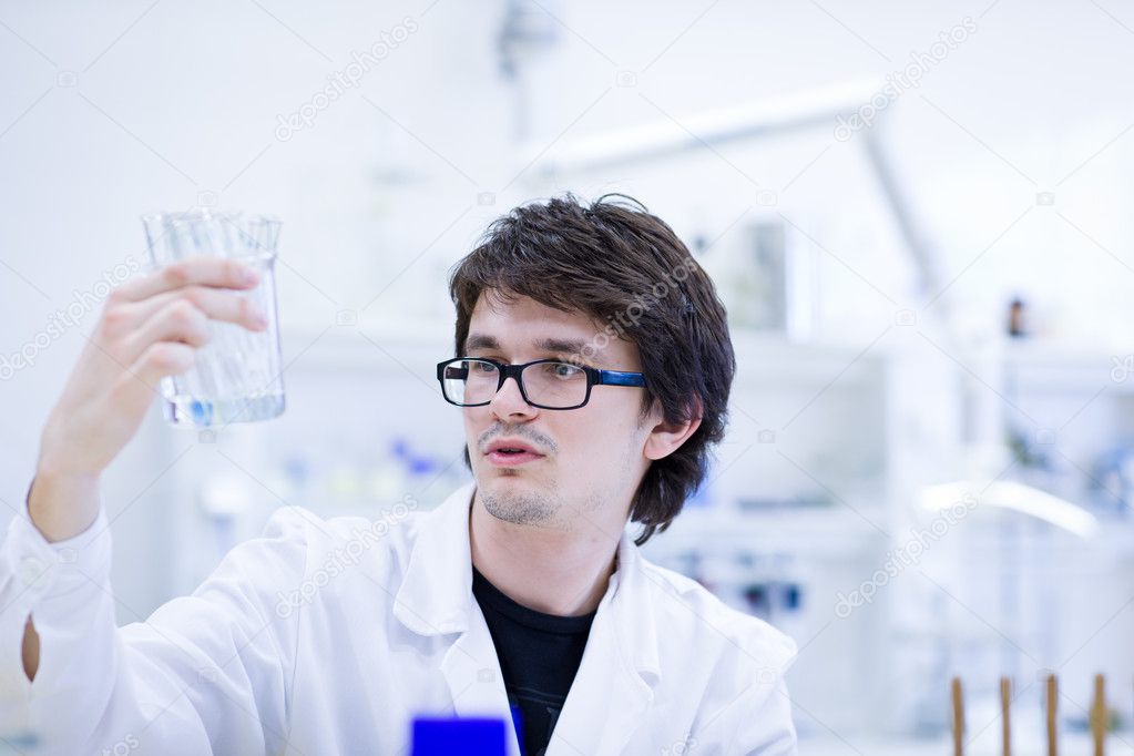Young male researcher carrying out scientific research in a chem
