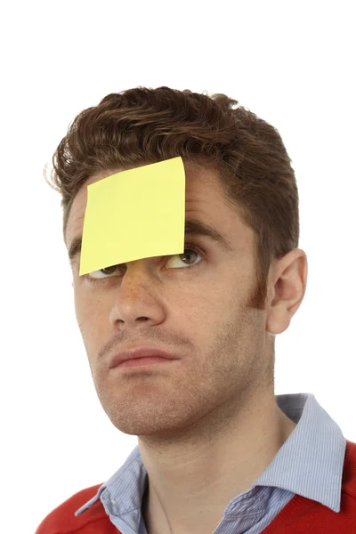 Man with post it on his forehead — Stock Photo, Image
