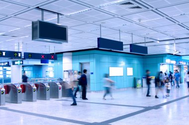 Moving in a train station. Blurred motion. clipart