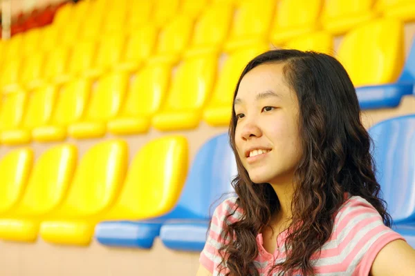 Asian girl on stadium — Stock Photo, Image