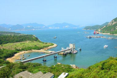 Coastline with mountain ridges in Hong Kong at day time clipart