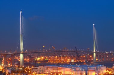 Stonecutters Bridge in Hong Kong with oil tanks clipart