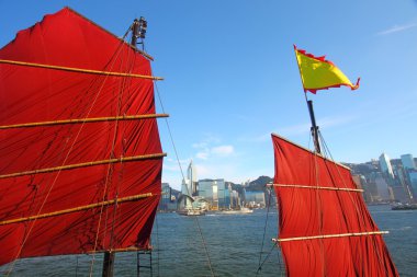 Junk boat flag along the harbour in Hong Kong clipart