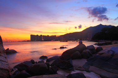 Sunset along the coast in Hong Kong clipart