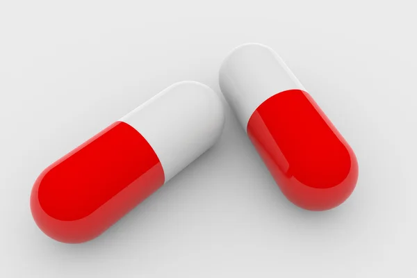 Stock image Two red and white pills